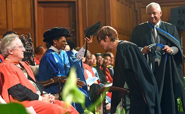 VC Prof Mamokgethi caps a Humanities graduate. With her on the podium are Prof Ed Rybicki, director of the University Research Committee (URC) Biopharming Research Unit (left) and admissions director Carl Herman.