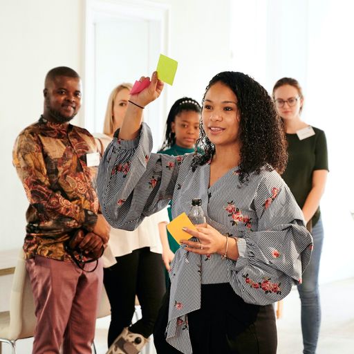 Photo of programme coordinator with sticky note